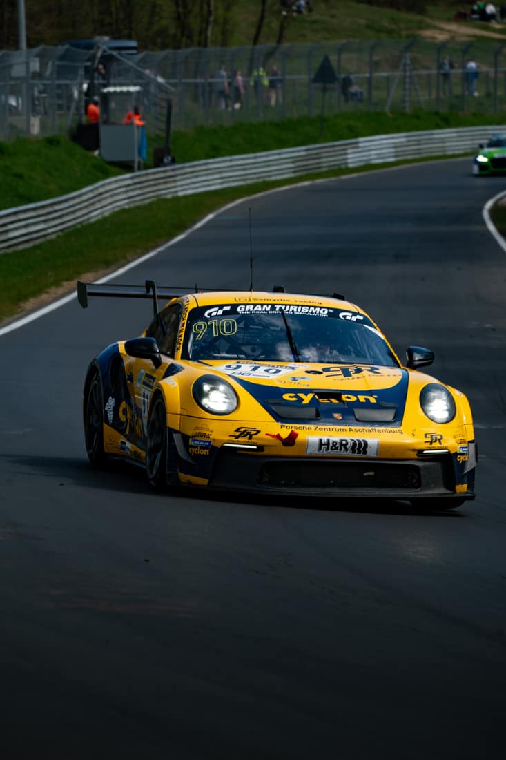 Yellow Smyrlis Racing Porsche in a corner